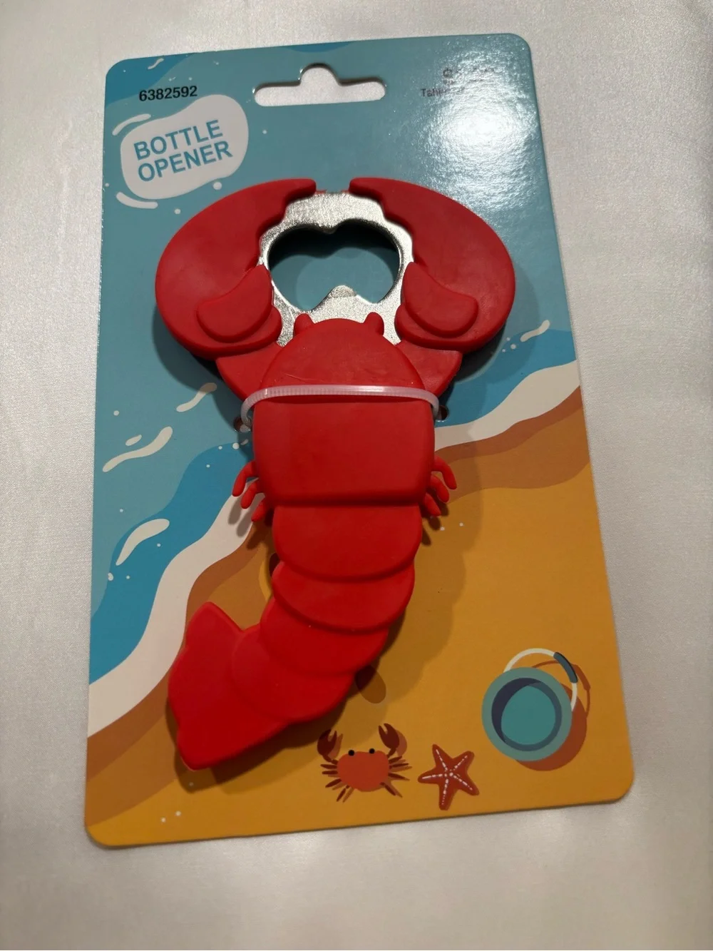 Lobster salt and pepper shakers and a lobster bottle opener
